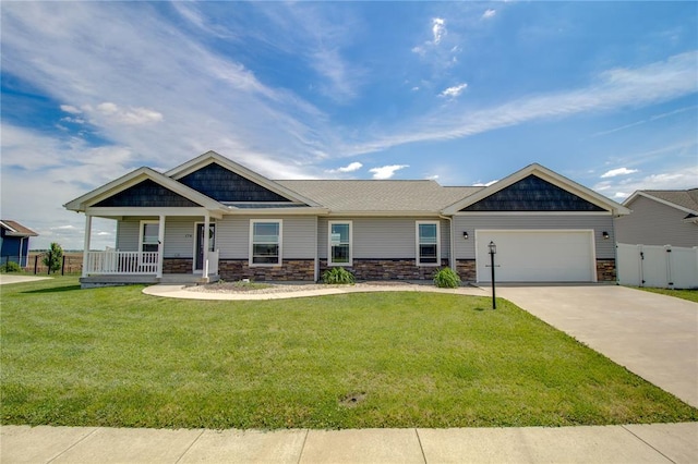 176 Bay Meadow Cir, Moro, IL 62067 - craftsman house with a porch, an attached garage, stone siding, and concrete driveway