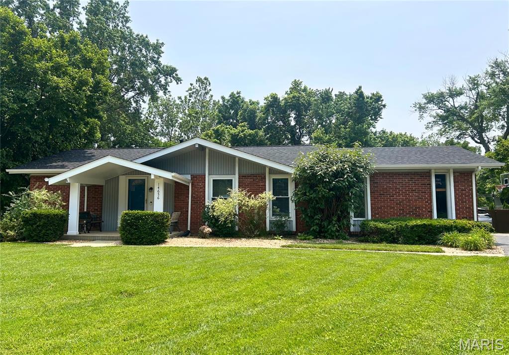 14656 Laketrails Ct, Chesterfield, MO 63017 - view of front facade with a front yard and brick siding