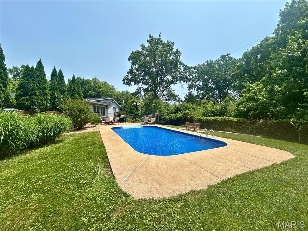 14656 Laketrails Ct, Chesterfield, MO 63017 - outdoor pool with a patio and a yard