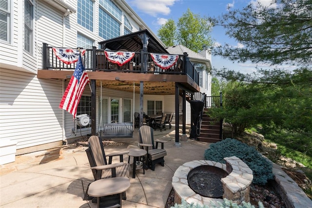 4516 Austin Point Ct, Saint Charles, MO 63304 - view of patio featuring a fire pit, stairway, and a wooden deck