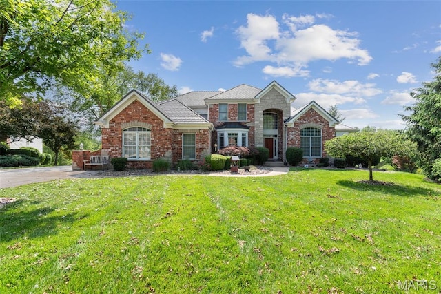 4516 Austin Point Ct, Saint Charles, MO 63304 - traditional home with a front yard and brick siding