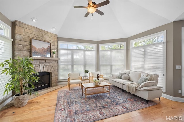 4516 Austin Point Ct, Saint Charles, MO 63304 - living area with vaulted ceiling, ceiling fan, a fireplace, and wood finished floors
