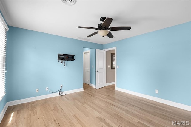 4516 Austin Point Ct, Saint Charles, MO 63304 - unfurnished bedroom with multiple windows, light wood-type flooring, and ceiling fan