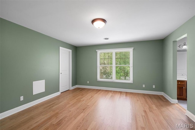 4516 Austin Point Ct, Saint Charles, MO 63304 - unfurnished bedroom featuring light wood-style flooring and connected bathroom