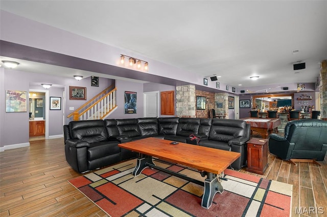 4516 Austin Point Ct, Saint Charles, MO 63304 - living area featuring light wood finished floors, stairway, and bar area