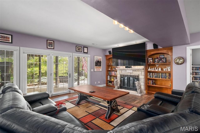 4516 Austin Point Ct, Saint Charles, MO 63304 - living room featuring a stone fireplace and wood finished floors