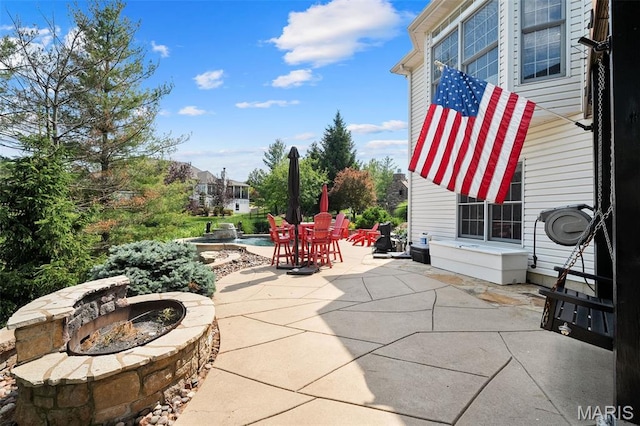 4516 Austin Point Ct, Saint Charles, MO 63304 - view of patio with a fire pit and outdoor dining space