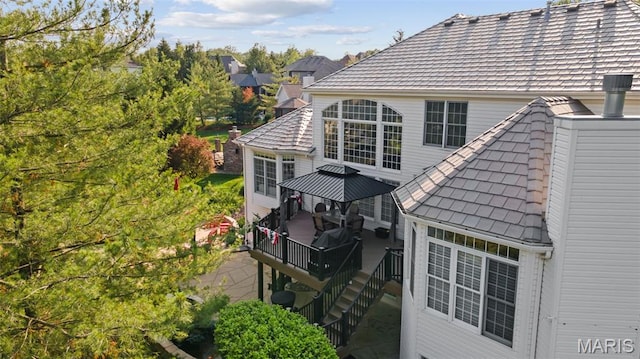 4516 Austin Point Ct, Saint Charles, MO 63304 - back of property featuring a gazebo, a wooden deck, and stairs