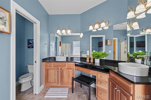 4516 Austin Point Ct, Saint Charles, MO 63304 - bathroom featuring a chandelier, double vanity, and tile patterned flooring
