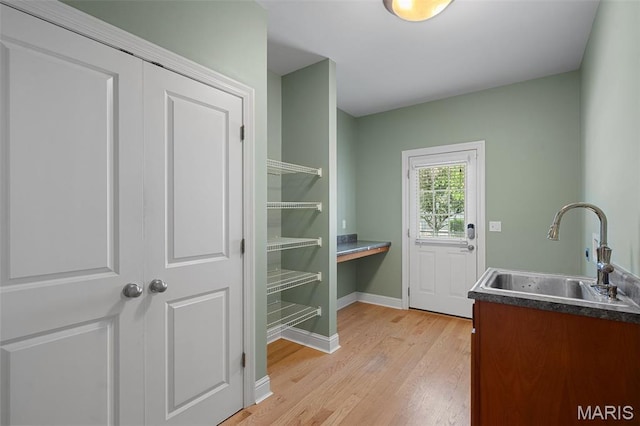 4516 Austin Point Ct, Saint Charles, MO 63304 - washroom featuring a sink and light wood-style floors