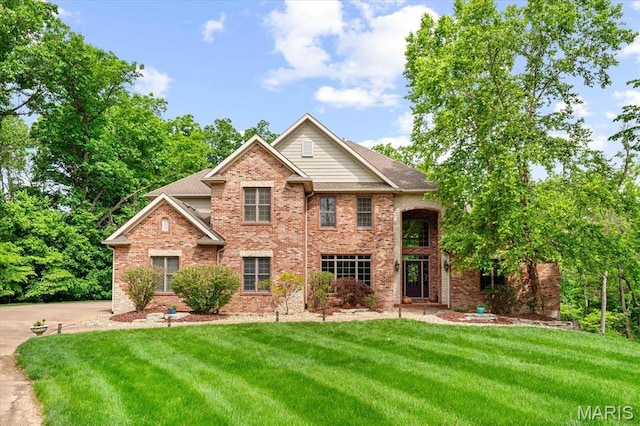 4516 Levis Ln, Godfrey, IL 62035 - traditional-style house with brick siding and a front lawn