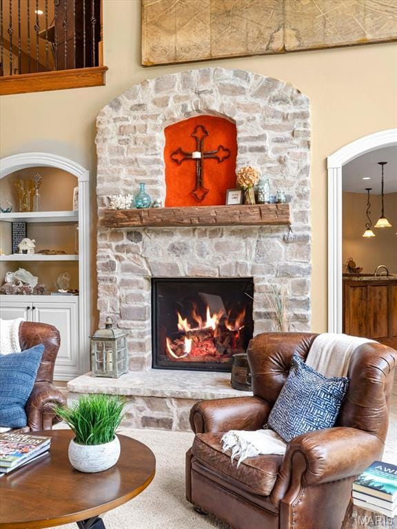 4516 Levis Ln, Godfrey, IL 62035 - living area featuring a stone fireplace and built in features