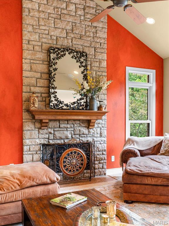 4516 Levis Ln, Godfrey, IL 62035 - living room featuring a fireplace, wood-type flooring, baseboards, a ceiling fan, and high vaulted ceiling