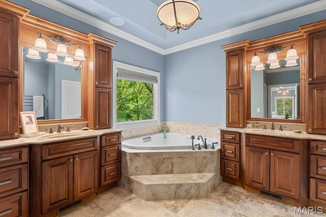 4516 Levis Ln, Godfrey, IL 62035 - bathroom featuring two vanities, a garden tub, and crown molding