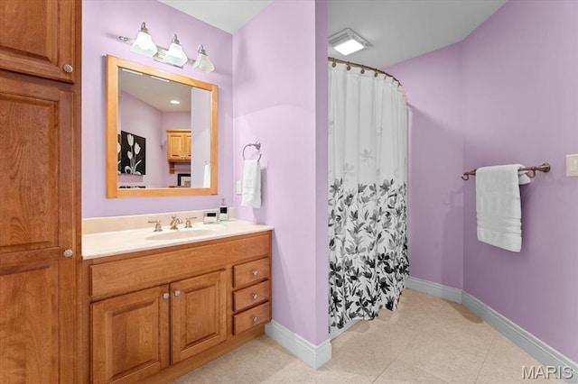 4516 Levis Ln, Godfrey, IL 62035 - bathroom with baseboards, vanity, a shower with shower curtain, and tile patterned flooring