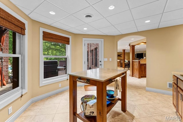 4516 Levis Ln, Godfrey, IL 62035 - dining space with ornate columns, light tile patterned floors, baseboards, a drop ceiling, and recessed lighting