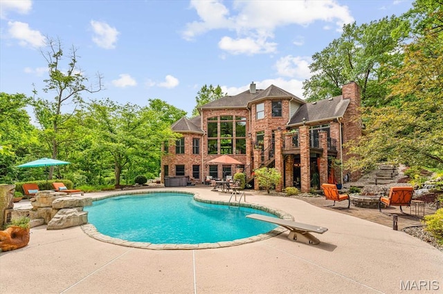 4516 Levis Ln, Godfrey, IL 62035 - outdoor pool featuring a patio, a diving board, and stairway