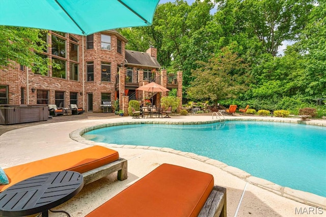 4516 Levis Ln, Godfrey, IL 62035 - swimming pool featuring a patio, area for grilling, and a diving board