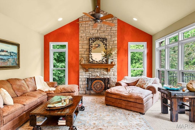 4516 Levis Ln, Godfrey, IL 62035 - living room featuring a ceiling fan, a stone fireplace, beam ceiling, recessed lighting, and high vaulted ceiling