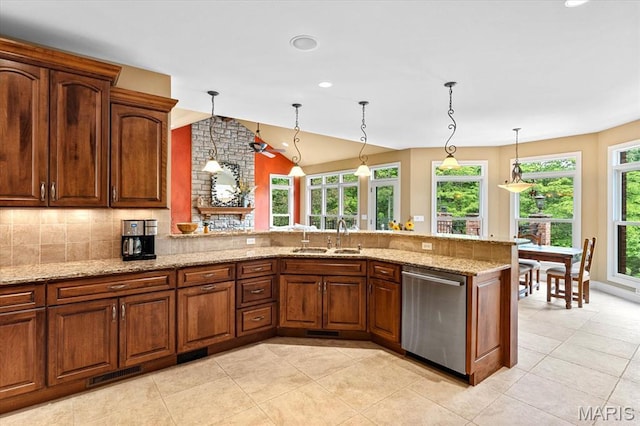 4516 Levis Ln, Godfrey, IL 62035 - kitchen featuring stainless steel dishwasher, vaulted ceiling, light stone countertops, decorative backsplash, and recessed lighting