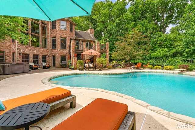 4516 Levis Ln, Godfrey, IL 62035 - swimming pool with a patio and a diving board
