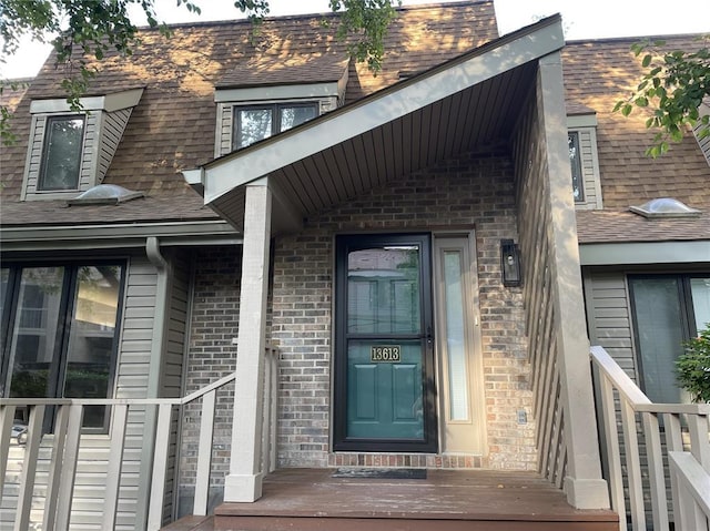 13613 Mason Oaks Ln Unit 3, Saint Louis, MO 63131 - doorway to property with brick siding and a shingled roof