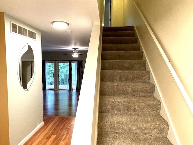 13613 Mason Oaks Ln Unit 3, Saint Louis, MO 63131 - staircase featuring wood finished floors, ceiling fan, and baseboards
