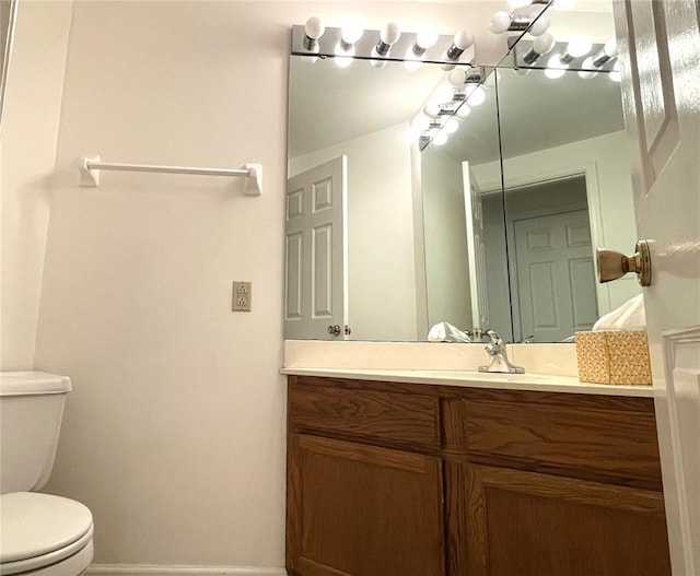 13613 Mason Oaks Ln Unit 3, Saint Louis, MO 63131 - bathroom featuring toilet, vanity, and baseboards