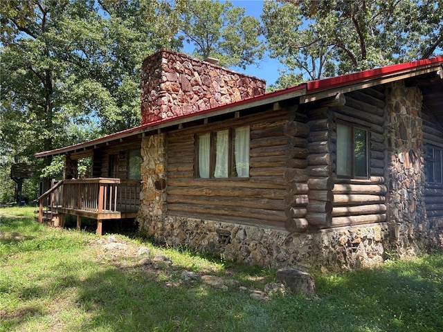 232 Ripley Unit A-1, Doniphan, MO 63935 - view of home's exterior featuring log exterior, a chimney, and a wooden deck