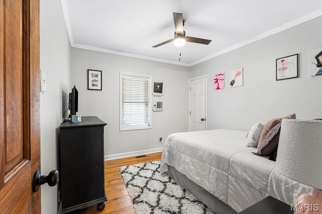 507 Alphonse Dr, Kirkwood, MO 63122 - bedroom featuring wood finished floors, crown molding, baseboards, and ceiling fan