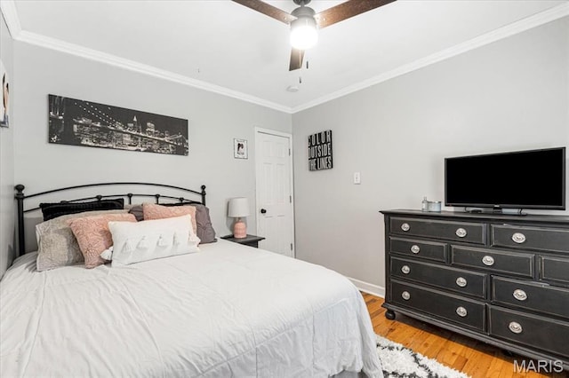 507 Alphonse Dr, Kirkwood, MO 63122 - bedroom featuring crown molding, light wood-style floors, a ceiling fan, and baseboards