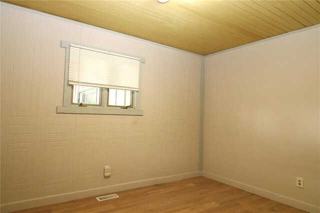 11 Glen Hollow Rd, Glen Carbon, IL 62034 - unfurnished room with light wood finished floors, baseboards, and wooden ceiling