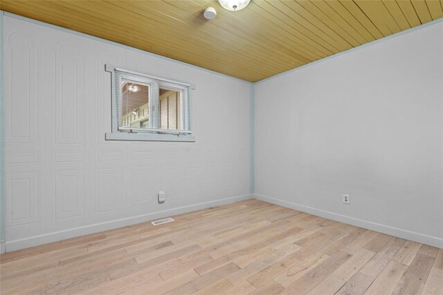 11 Glen Hollow Rd, Glen Carbon, IL 62034 - unfurnished room featuring wood ceiling, light wood finished floors, and baseboards
