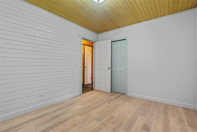 11 Glen Hollow Rd, Glen Carbon, IL 62034 - empty room with light wood-style flooring, baseboards, and wood ceiling