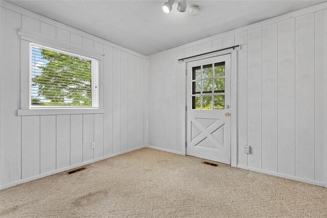 11 Glen Hollow Rd, Glen Carbon, IL 62034 - unfurnished room featuring carpet floors, a smoke detector, and wooden walls