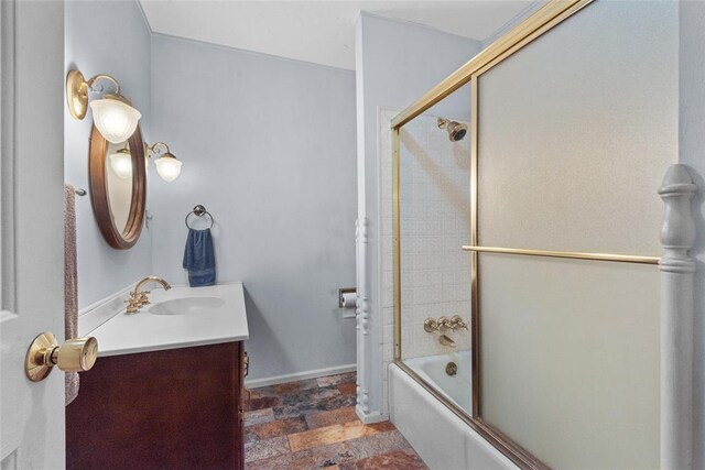 11 Glen Hollow Rd, Glen Carbon, IL 62034 - full bathroom featuring vanity, bath / shower combo with glass door, stone finish floors, and baseboards