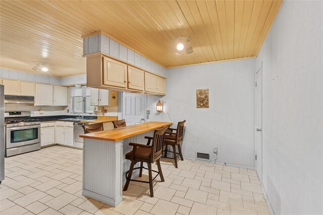 11 Glen Hollow Rd, Glen Carbon, IL 62034 - kitchen featuring stainless steel appliances, wood ceiling, under cabinet range hood, a breakfast bar, and a sink