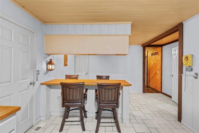 11 Glen Hollow Rd, Glen Carbon, IL 62034 - dining area with wood ceiling and baseboards