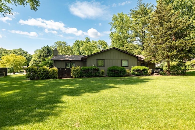 11 Glen Hollow Rd, Glen Carbon, IL 62034 - view of front facade featuring a chimney and a front lawn