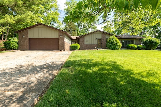 11 Glen Hollow Rd, Glen Carbon, IL 62034 - view of front of house featuring brick siding, concrete driveway, a garage, and a front yard