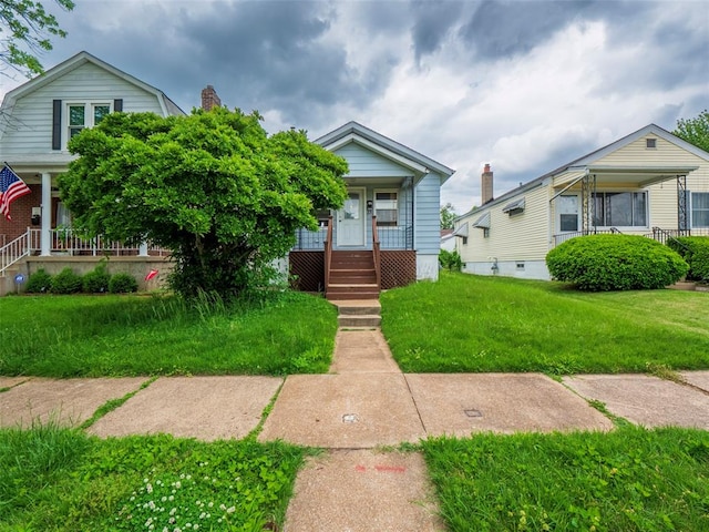 5609 Lansdowne, Saint Louis, MO 63109 - view of front facade featuring covered porch and a front lawn