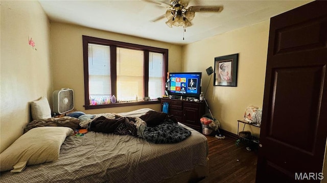 5044 Louisiana Ave, Saint Louis, MO 63111 - bedroom with dark wood-style flooring, baseboards, and a ceiling fan
