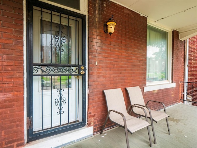 2614 Minnesota, Saint Louis, MO 63118 - doorway to property with a porch and brick siding