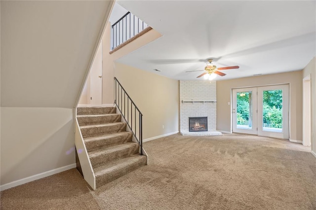 243 Mill Run Ln, Saint Peters, MO 63376 - unfurnished living room featuring carpet, a ceiling fan, baseboards, a fireplace, and stairway