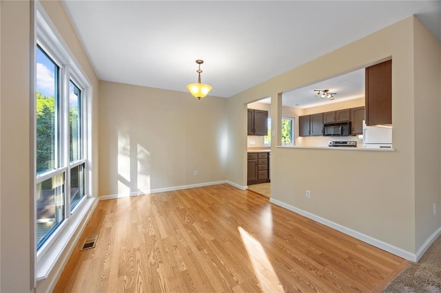 243 Mill Run Ln, Saint Peters, MO 63376 - unfurnished living room featuring light wood finished floors and baseboards