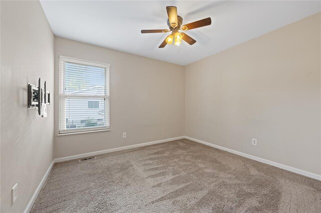 243 Mill Run Ln, Saint Peters, MO 63376 - spare room featuring carpet floors, baseboards, and ceiling fan