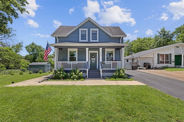 120 W Thornton Ave, Webster Groves, MO 63119 - bungalow featuring covered porch, an outbuilding, and a garage