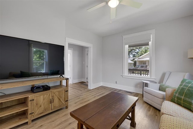 120 W Thornton Ave, Webster Groves, MO 63119 - living room with ceiling fan, light wood-style flooring, and baseboards