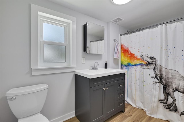 120 W Thornton Ave, Webster Groves, MO 63119 - bathroom with vanity, wood finished floors, toilet, and baseboards