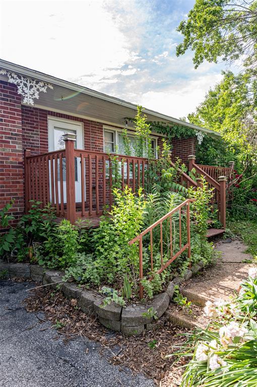 300 N Alvarado Ave, Belle, MO 65013 - rear view of house with brick siding and a deck
